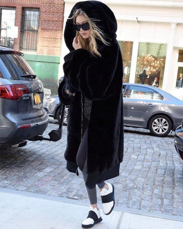 stunning gigi hadid walking outside wearing her oslo black oversized faux fur coat