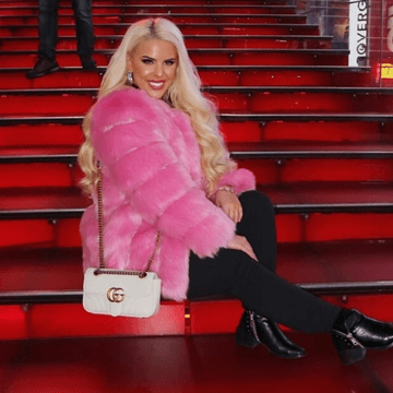 blonde girl wearing pink furever faux fur coat